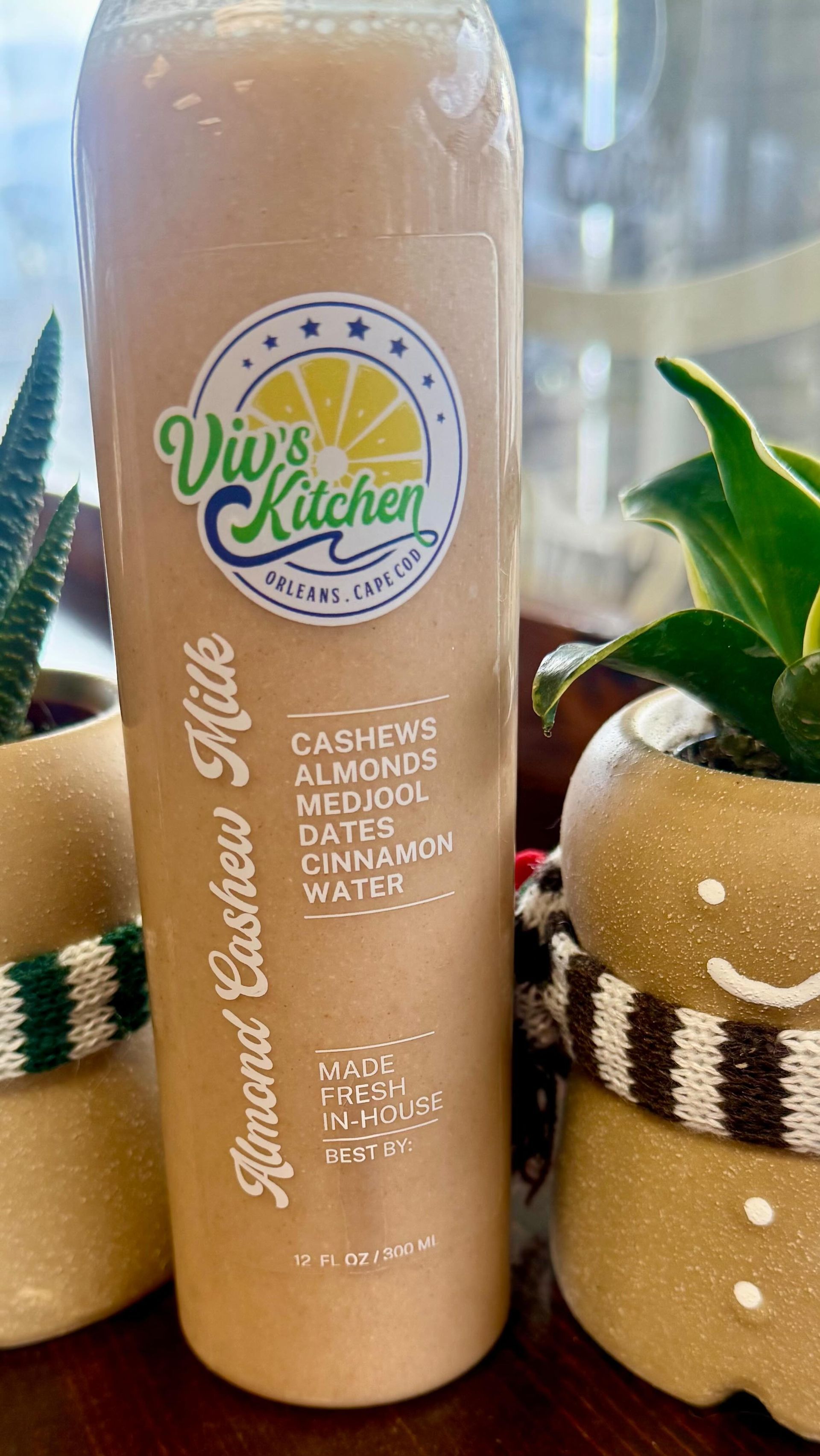 Bottle of almond cashew milk .