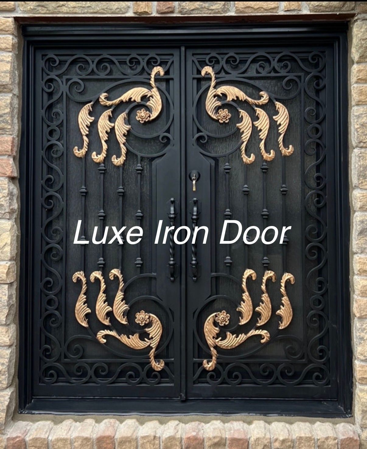 A black double iron door featuring gold-accented scrollwork and vertical iron bars, set within a stone-textured entryway.