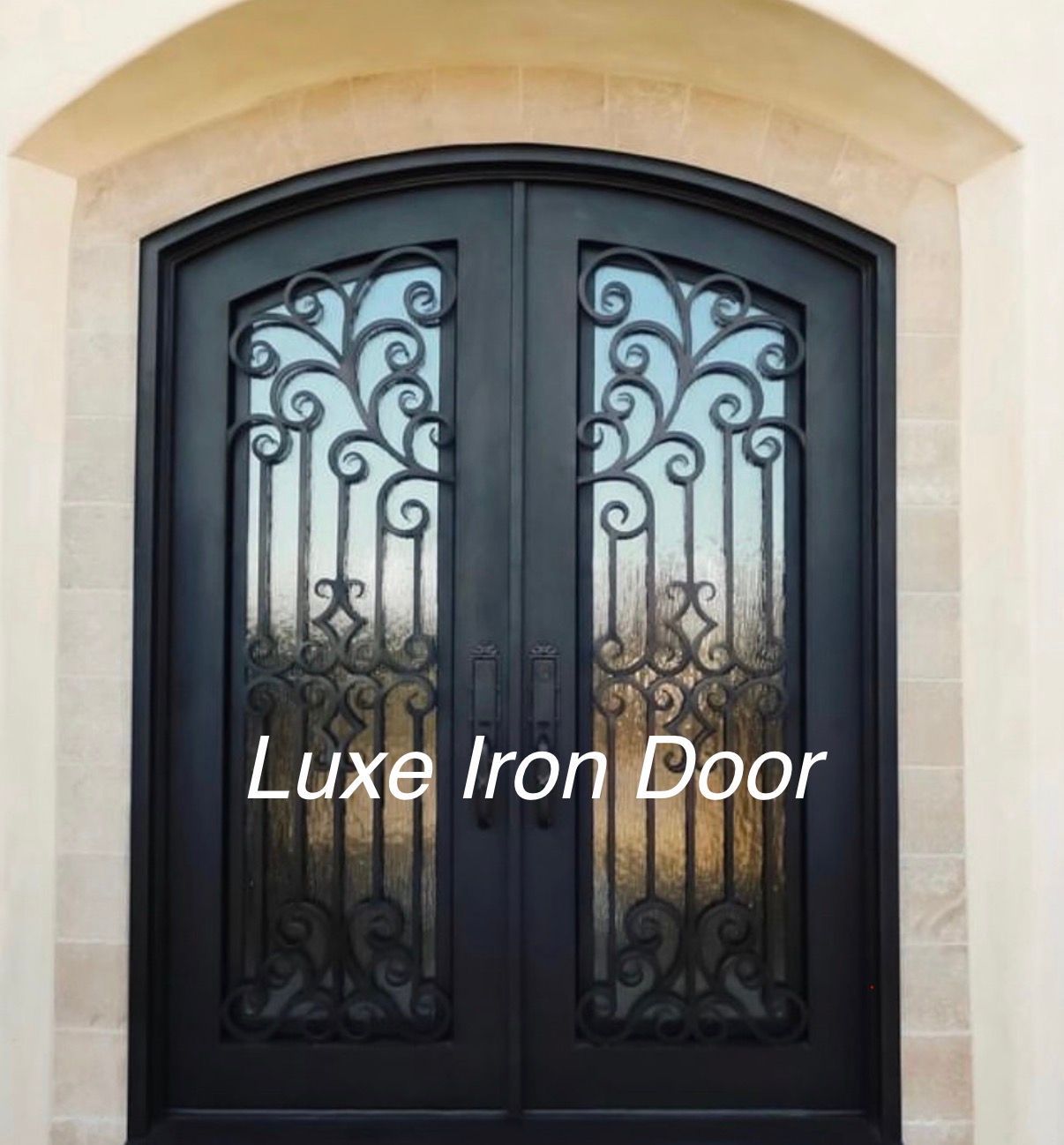 Black ornate iron double front door with arched glass panels and decorative scrollwork