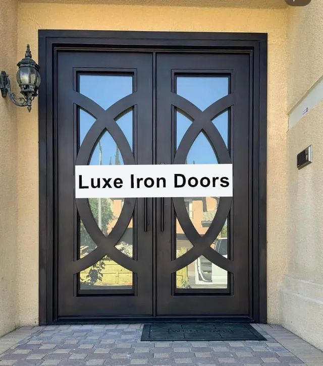A pair of double doors with a light on the side of the door.