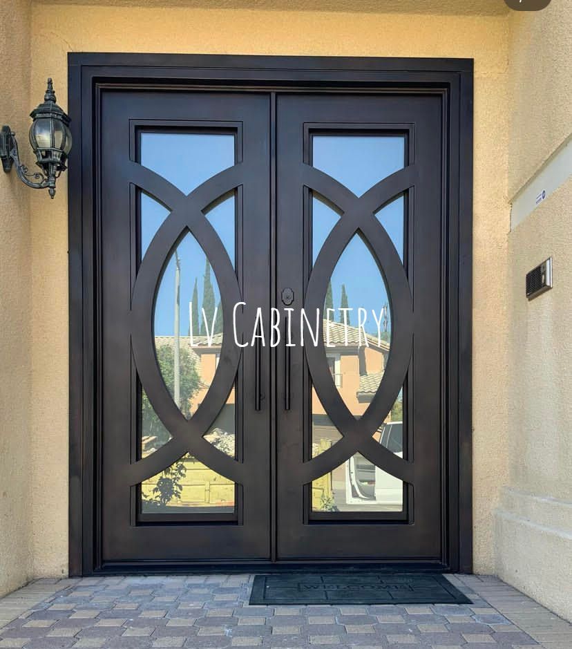 A pair of double doors with a light on the side of the door.