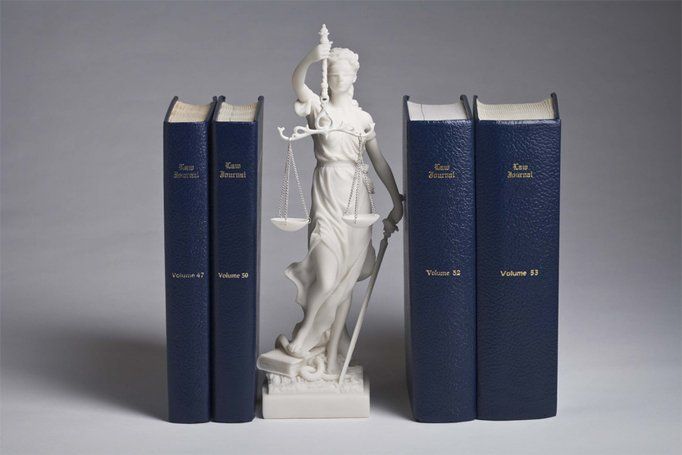 Statue and books