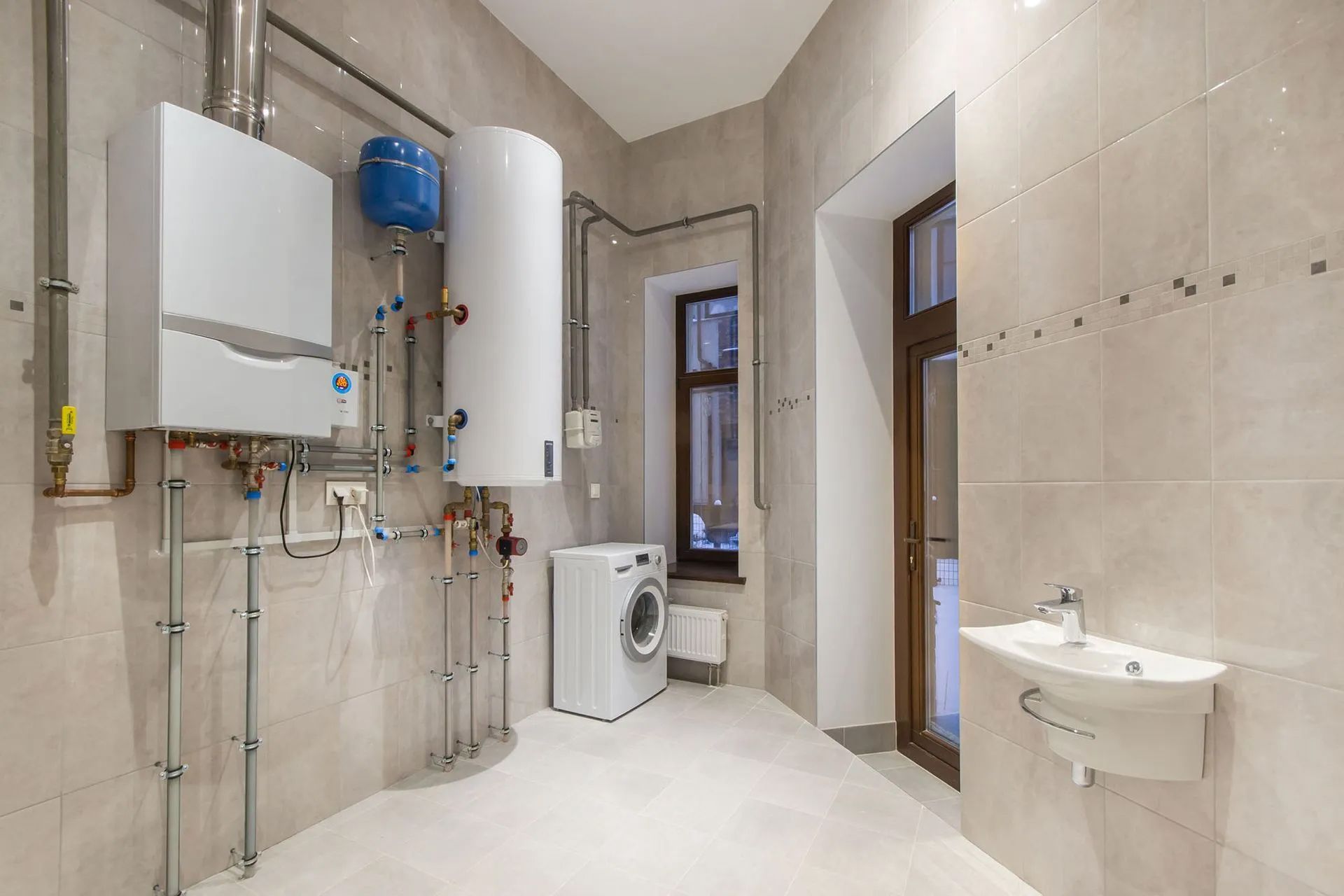 a laundry room with a washer and dryer and a water heater