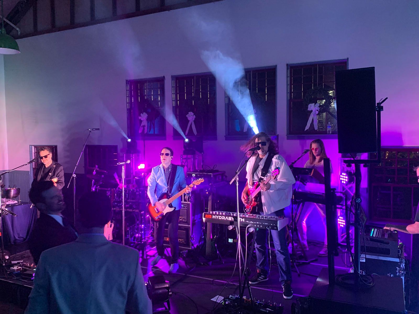 A group of people are playing instruments on a stage