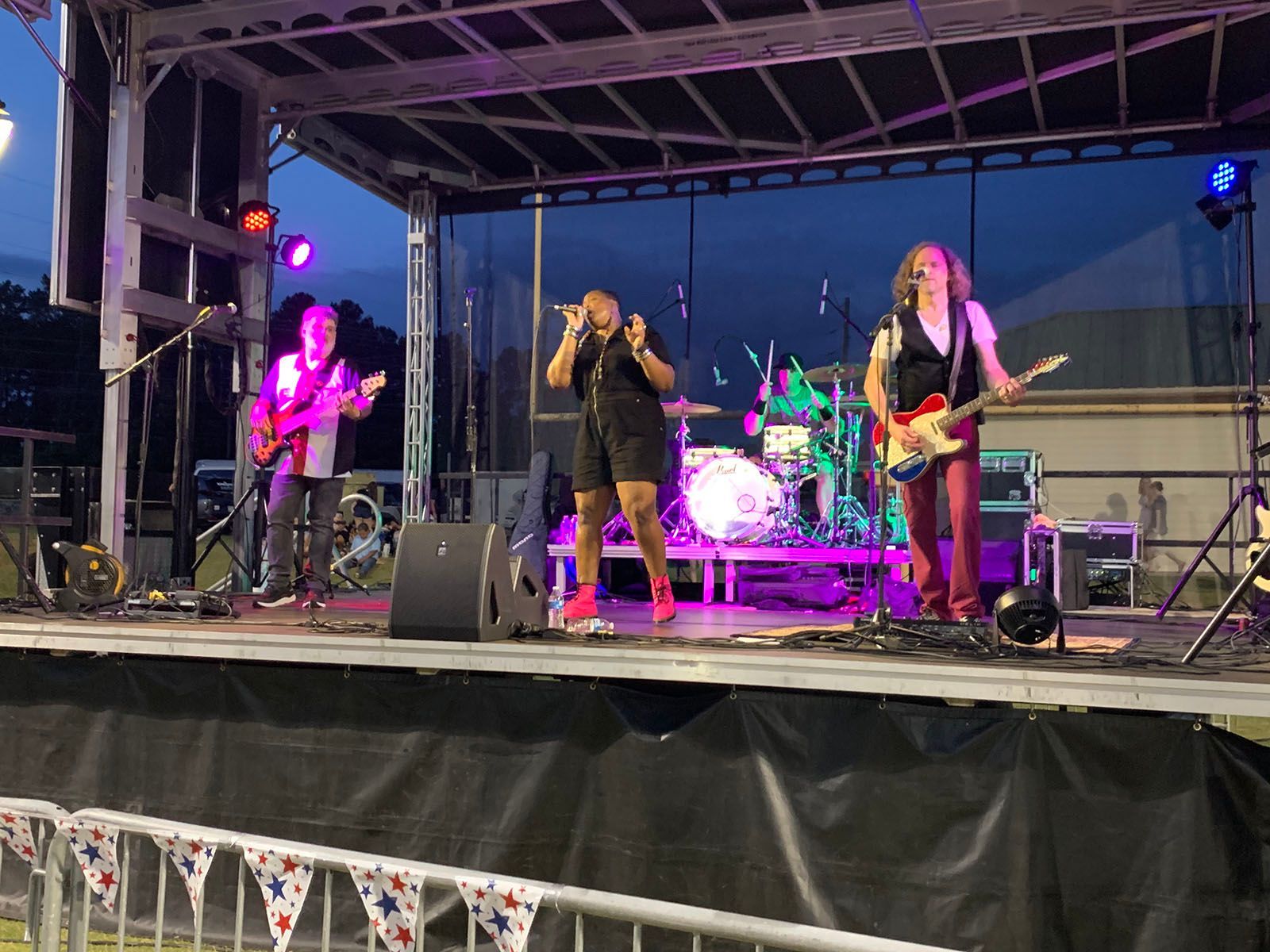 A group of people are playing instruments on a stage