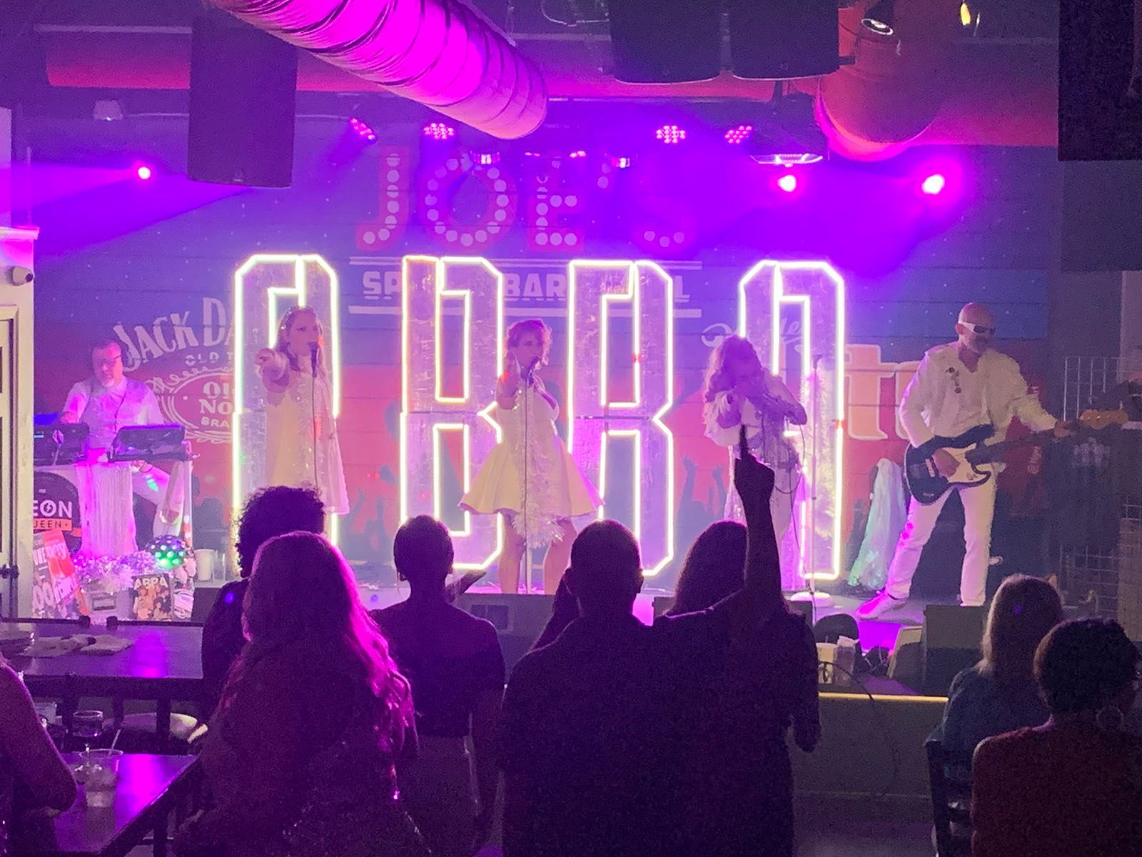 People standing in front of a stage