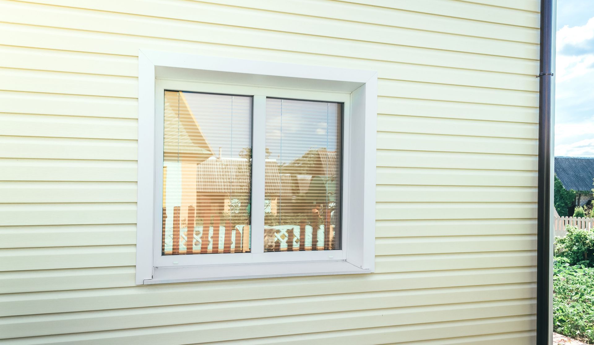 There is a window on the side of a house.