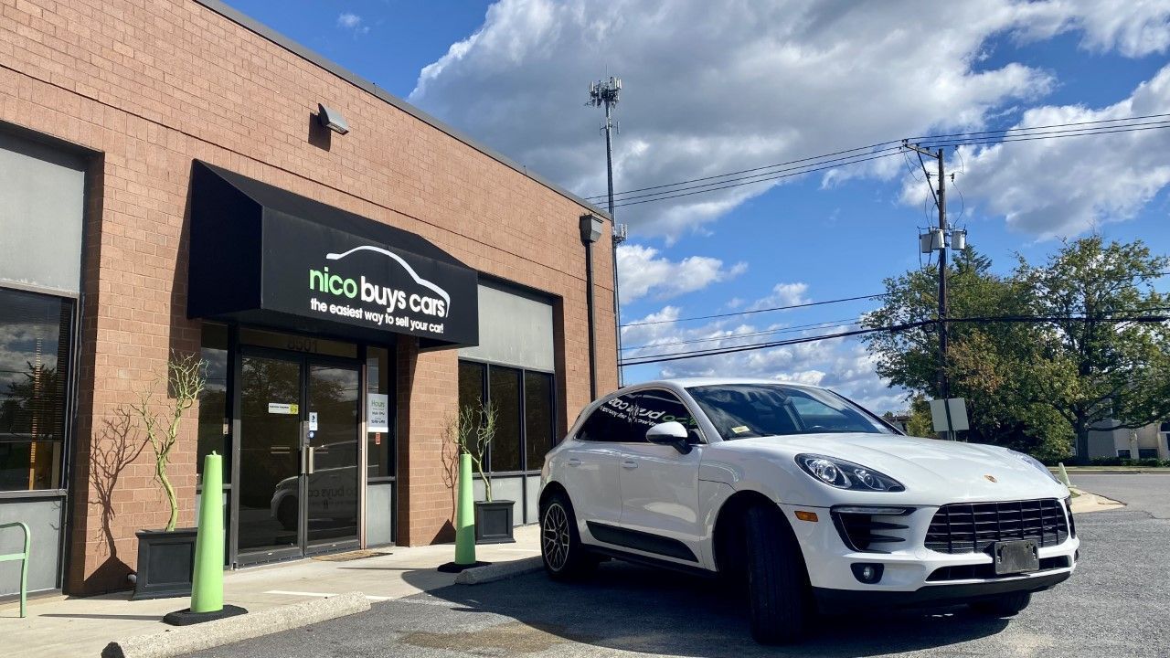 White Car Parked Front of Nico Buys Cars