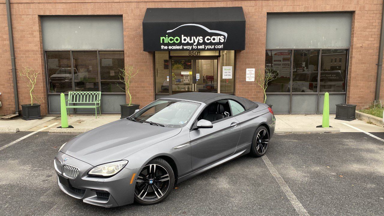 Grey BMW Car Parked Front of Nico Buys Cars