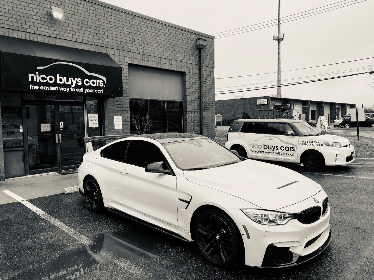 White BMW Car Parked Front of Nico Buys Cars