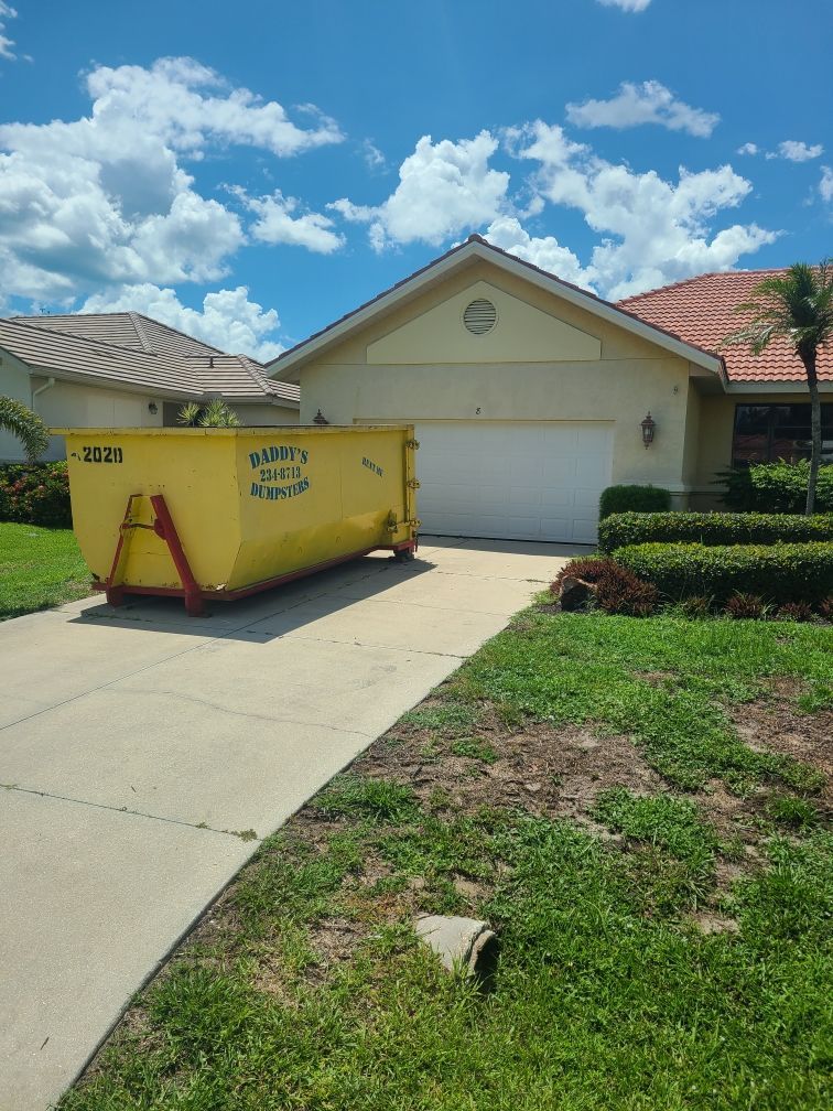 20-yard dumpster rental in North Port driveway – perfect for medium-sized projects like renovations 