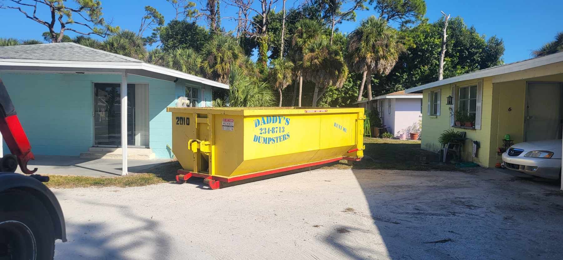15 yard dumpster delivered to a driveway during the holidays for a garage cleanout
