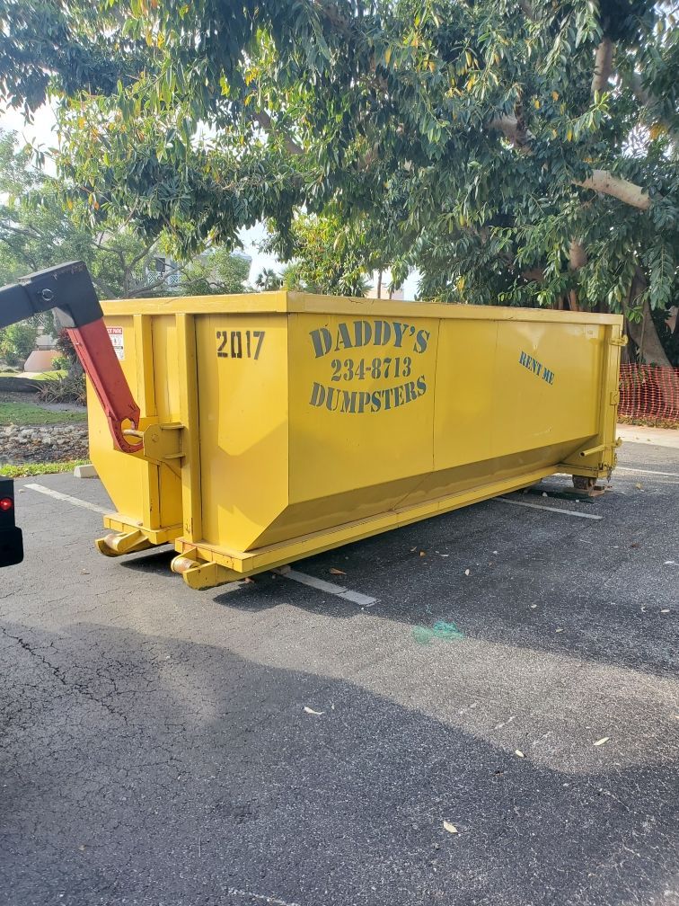20-yard roll-off dumpster delivered to residential driveway in Venice, FL — ideal for roof tear-off
