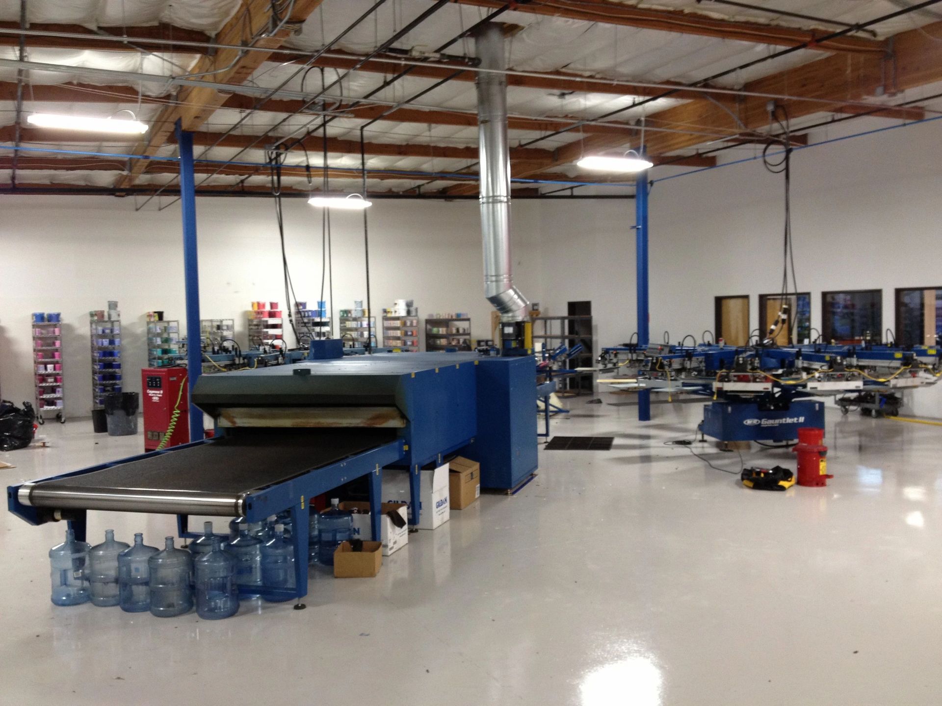 A conveyor belt carrying water bottles in a factory