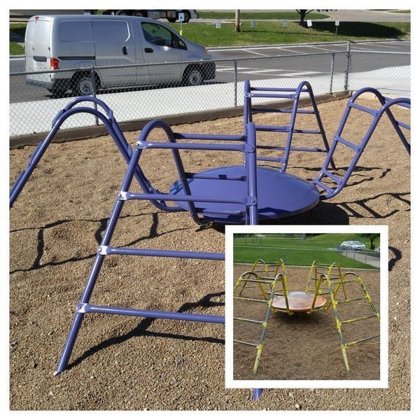 Playground spider web structure with a purple or yellow center circle, ladders, and a van in the background.