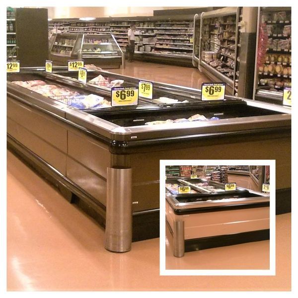 Refrigerated food display in a grocery store, with price tags and an inset view of a portion of the display.