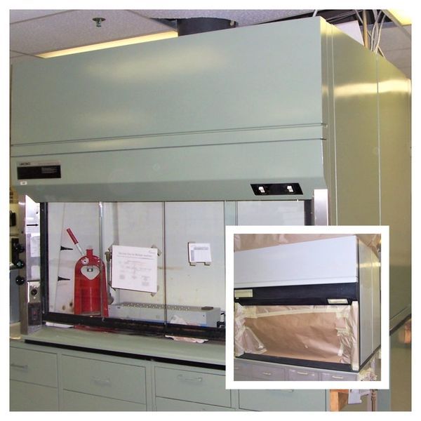Green laboratory fume hood. Inset shows plastic covering the opening.