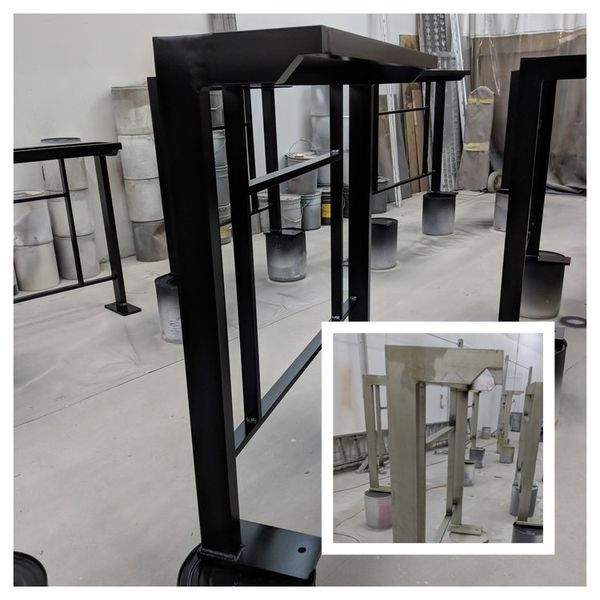 Black metal frames, likely for a structure, are being painted in a workshop. A smaller inset shows them before painting.