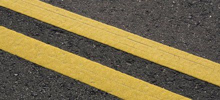 Yellow stripes on asphalt