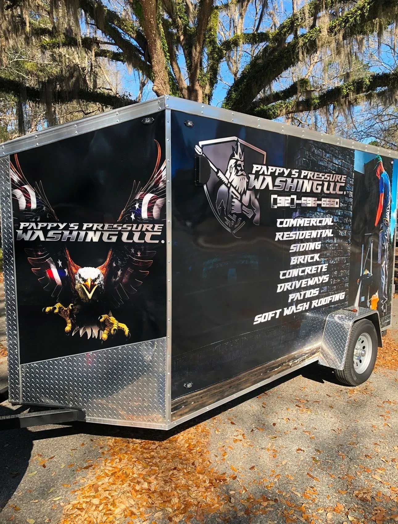 Black trailer with company graphics.