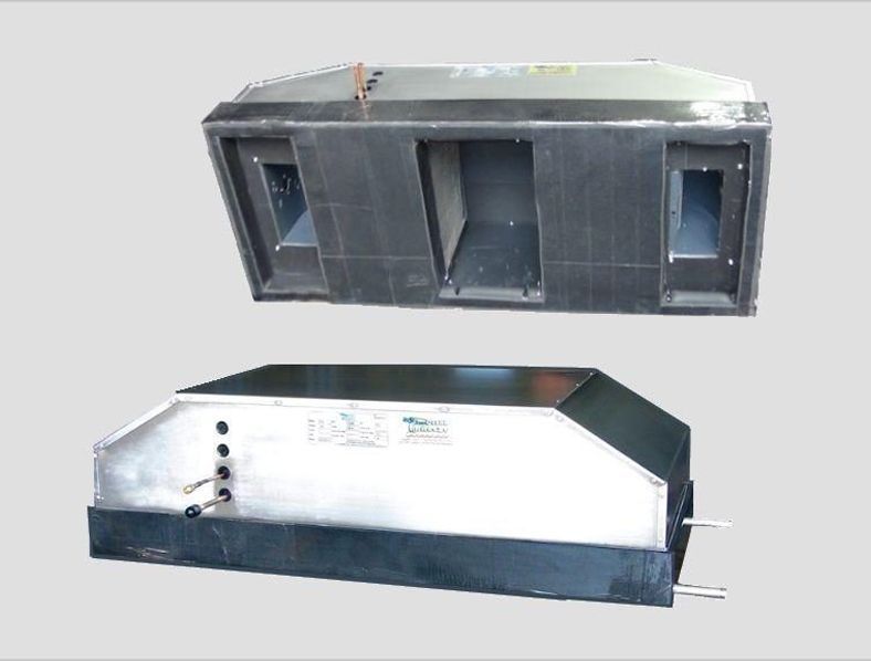 Two metal boxes are sitting on top of each other on a gray surface.