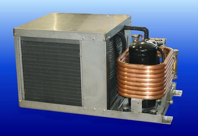 A box with copper pipes and a compressor inside of it