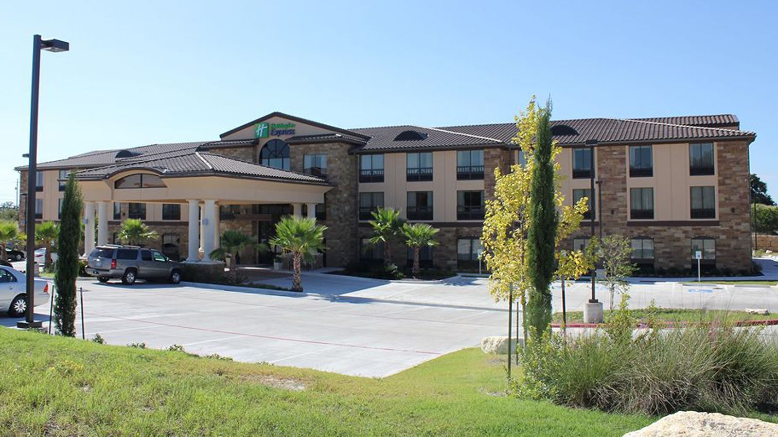 natural stone, stucco, and clay tile roofing