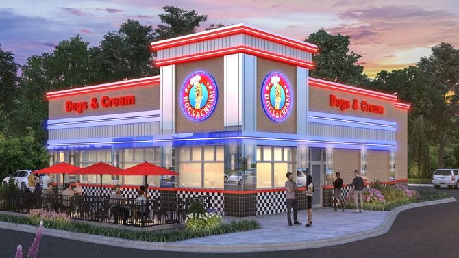 Exterior of a colorful Dog & Creams restaurant at dusk, with outdoor seating and neon trim.