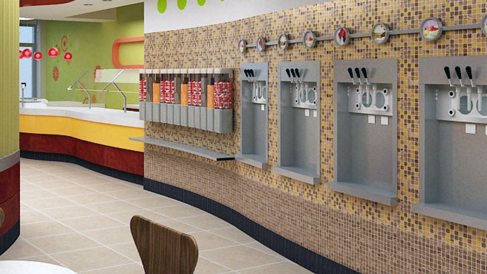 Empty frozen yogurt self-serve counter with dispensers, topping bins, and bright red-yellow decor