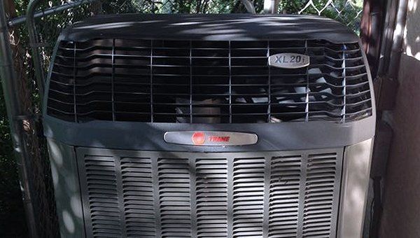 Learn More About Cooling Services AC unit outside the house