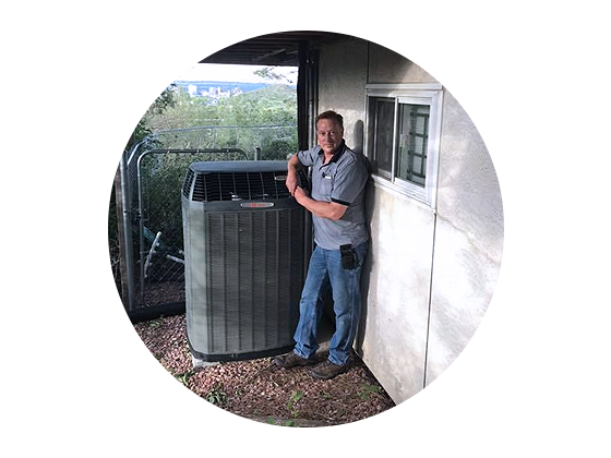 Man standing in front of AC unit