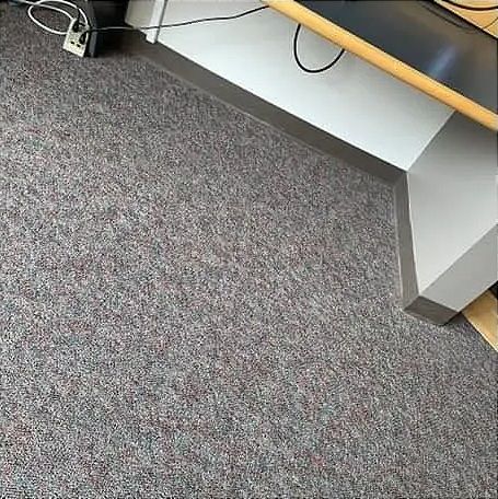 a gray carpet floor without the seam showing
