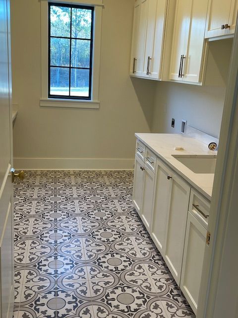 An empty small kitchen storage with a sink