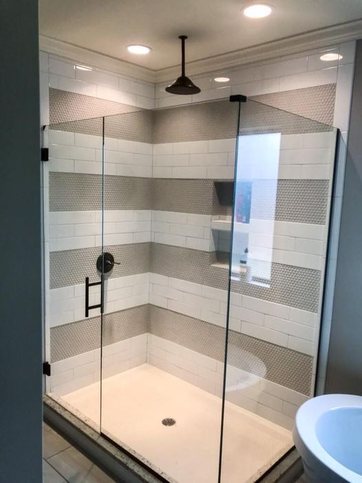 enclosed white and gray shower area