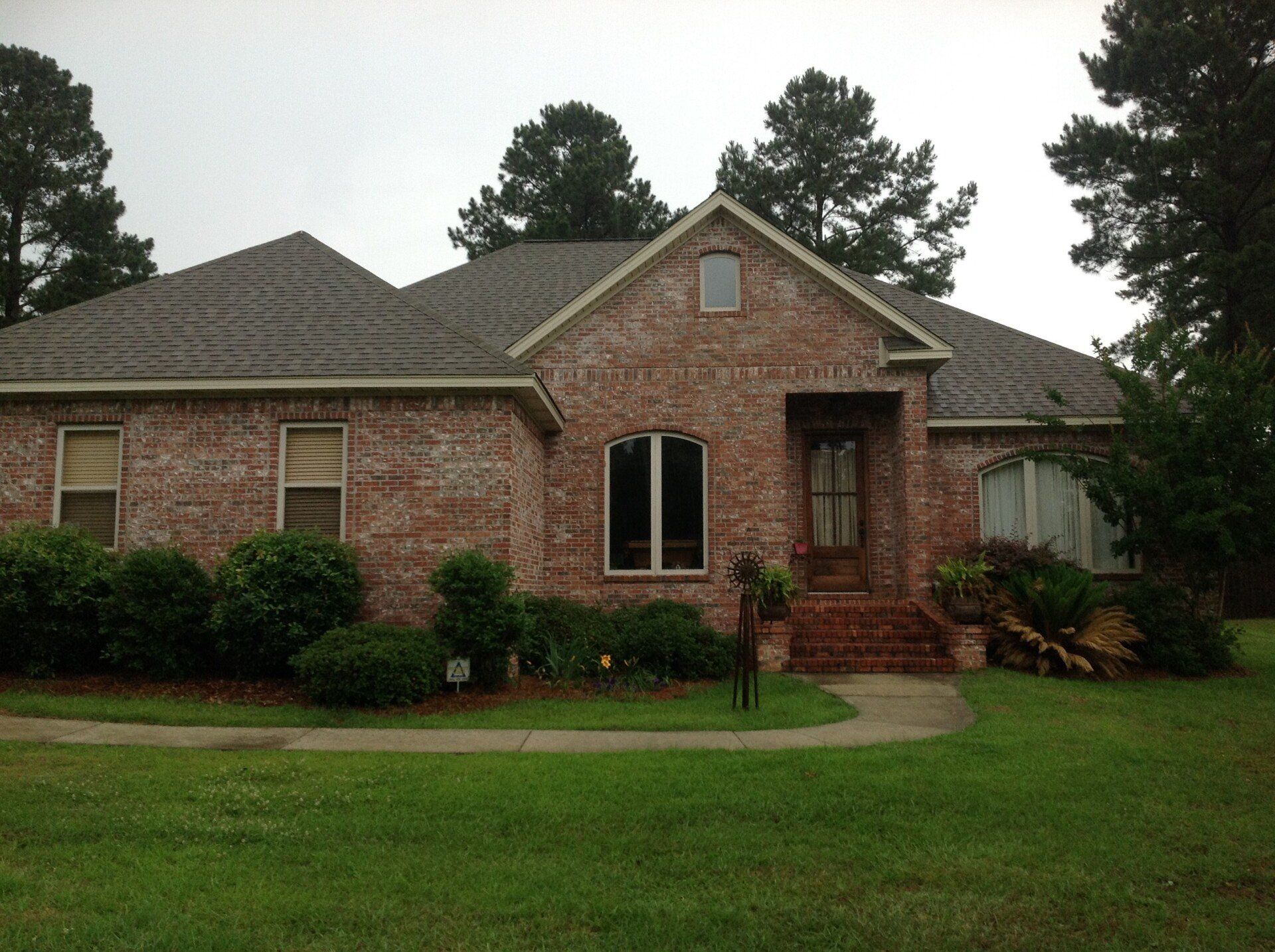 Outdoor house with brick walls and trees