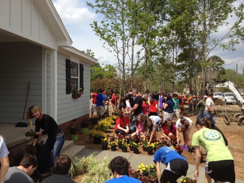 hgtv house with volunteers