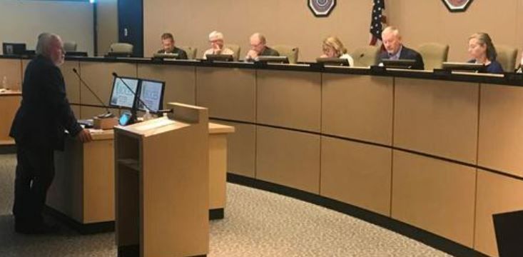 Project manager Bill Guman, left, asks the El Paso County Planning Commission for approval on a proposed 86-acre trade school campus on Judge Orr Road near Peyton.