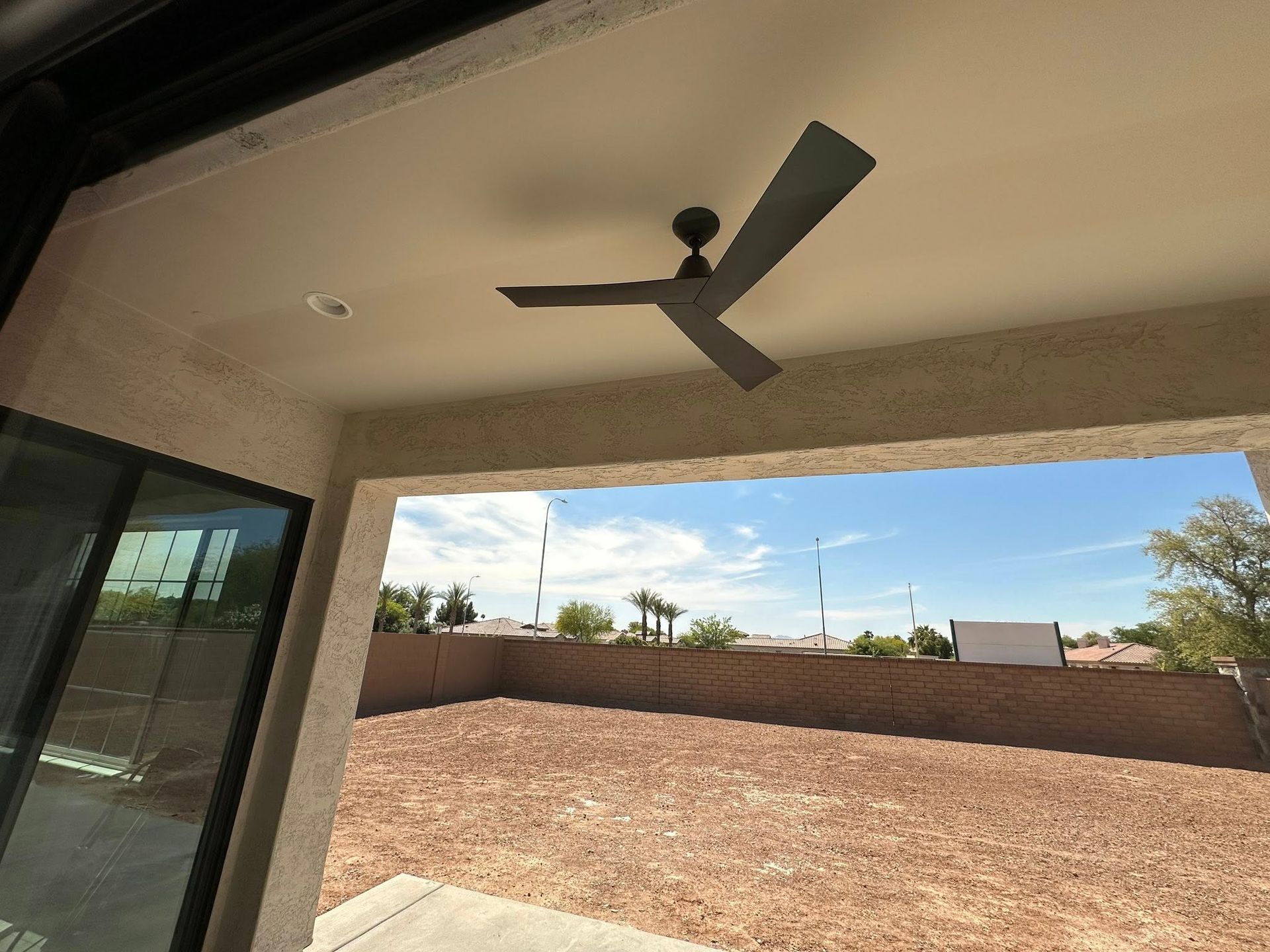 A ceiling fan is hanging from the ceiling of a house
