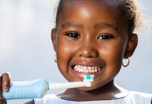 Girl holding a tooth brush