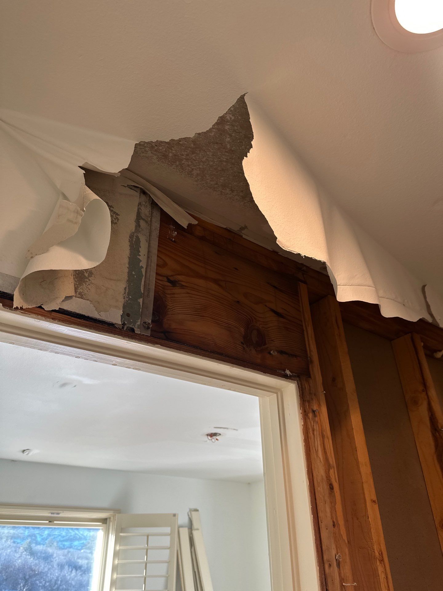 Broken ceiling die to water damage