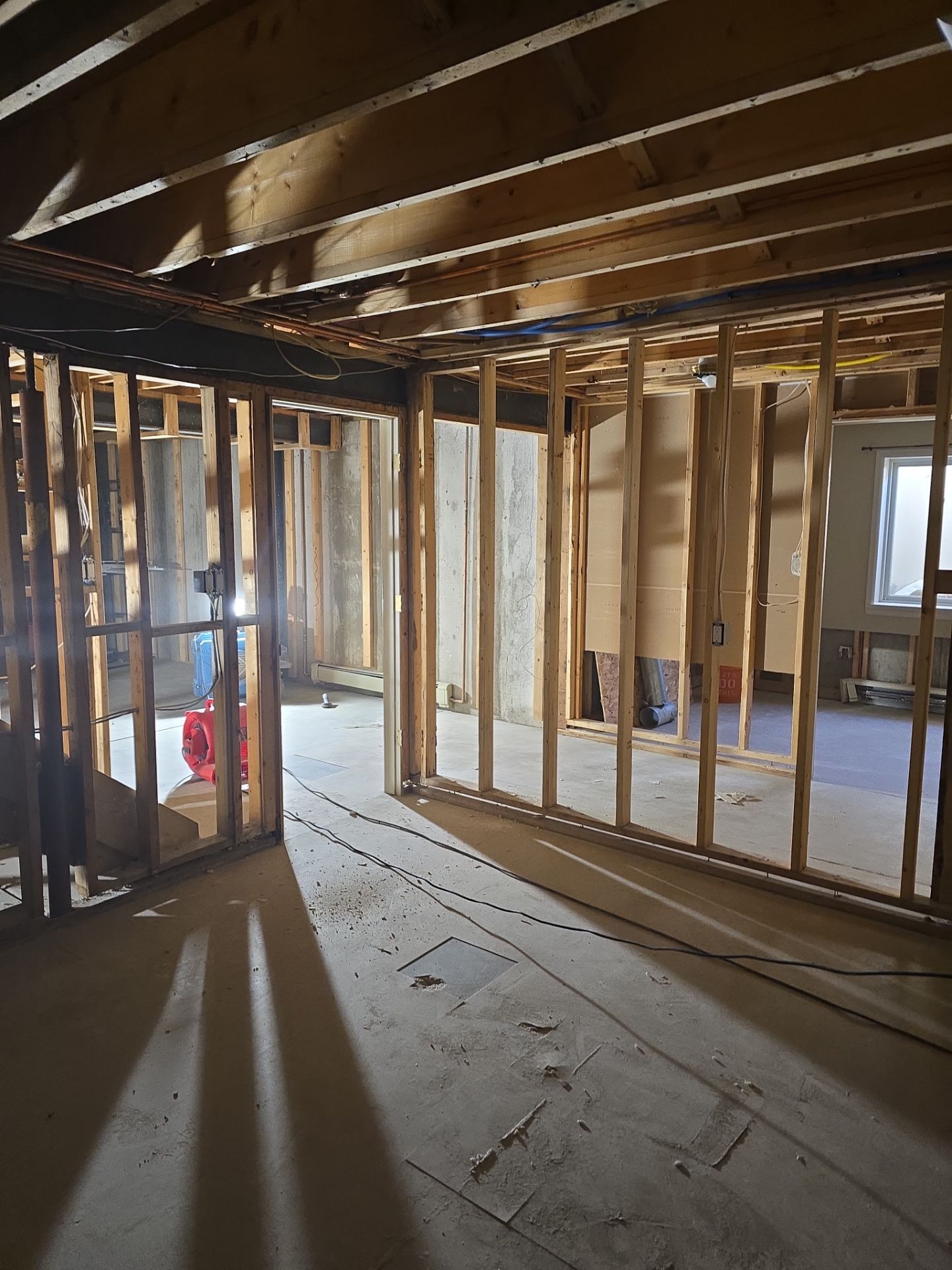 A room with a lot of wooden beams and a window