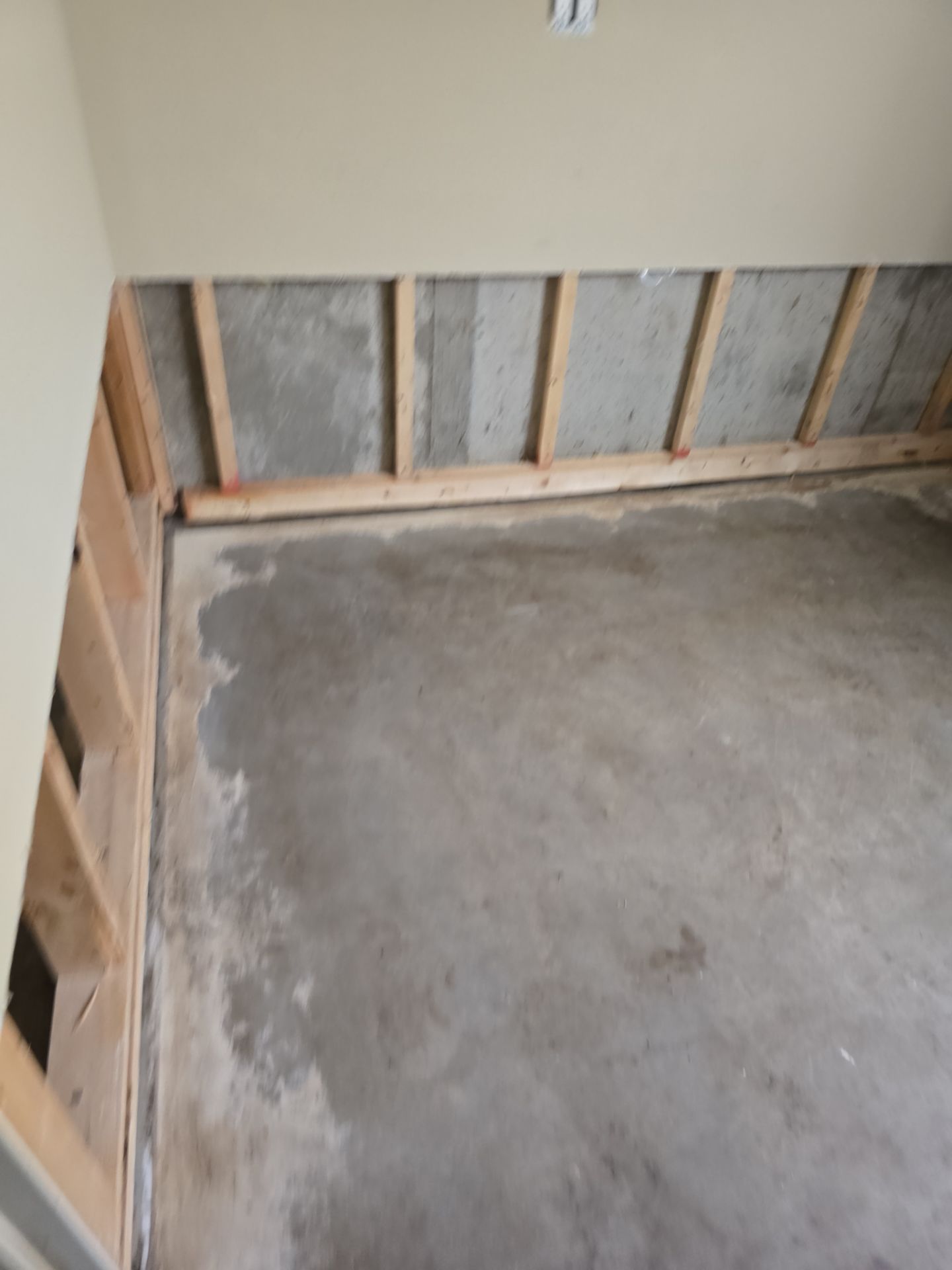 A room with a concrete floor