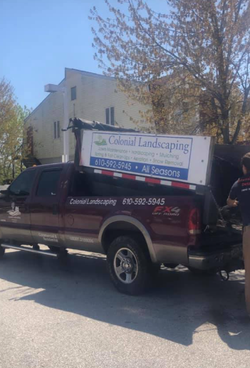 A maroon pickup truck with a large, white 