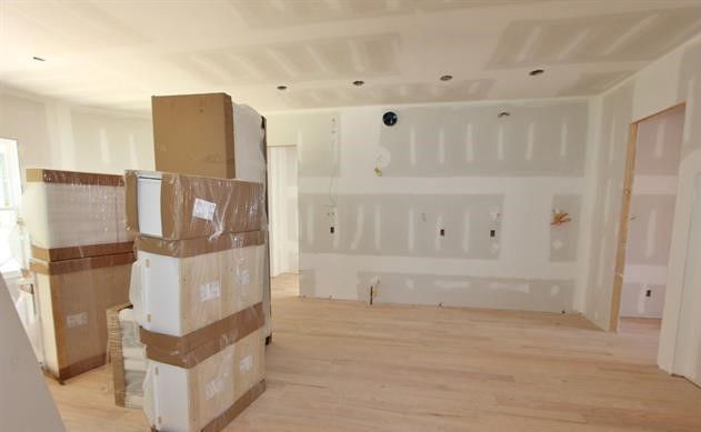 A room with a lot of boxes stacked on top of each other.