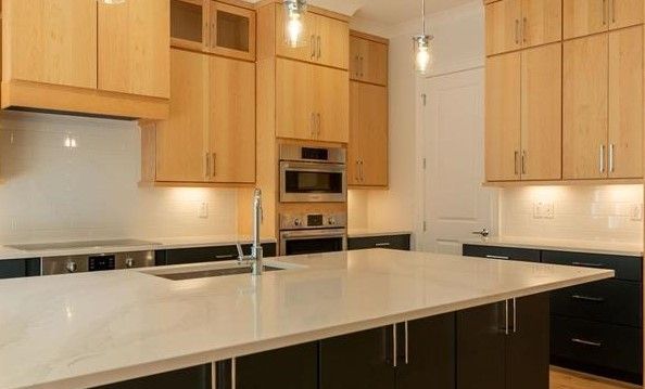 There is a large island in the middle of the kitchen.