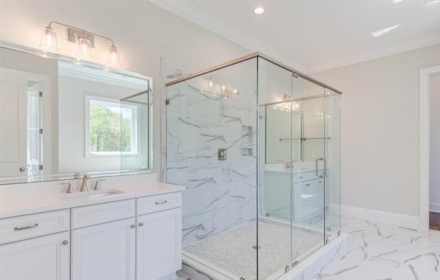 A bathroom with a walk in shower , sink and mirror.