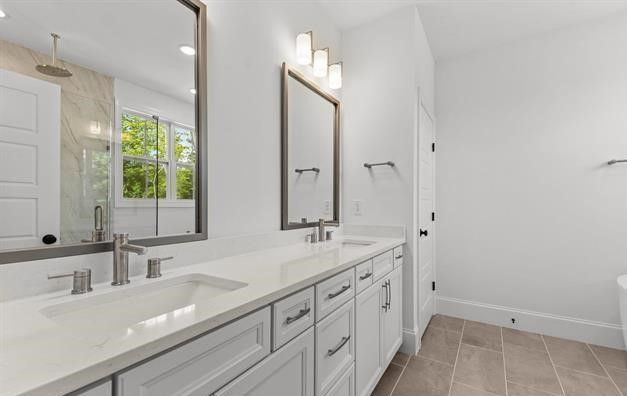 A bathroom with two sinks and two mirrors.