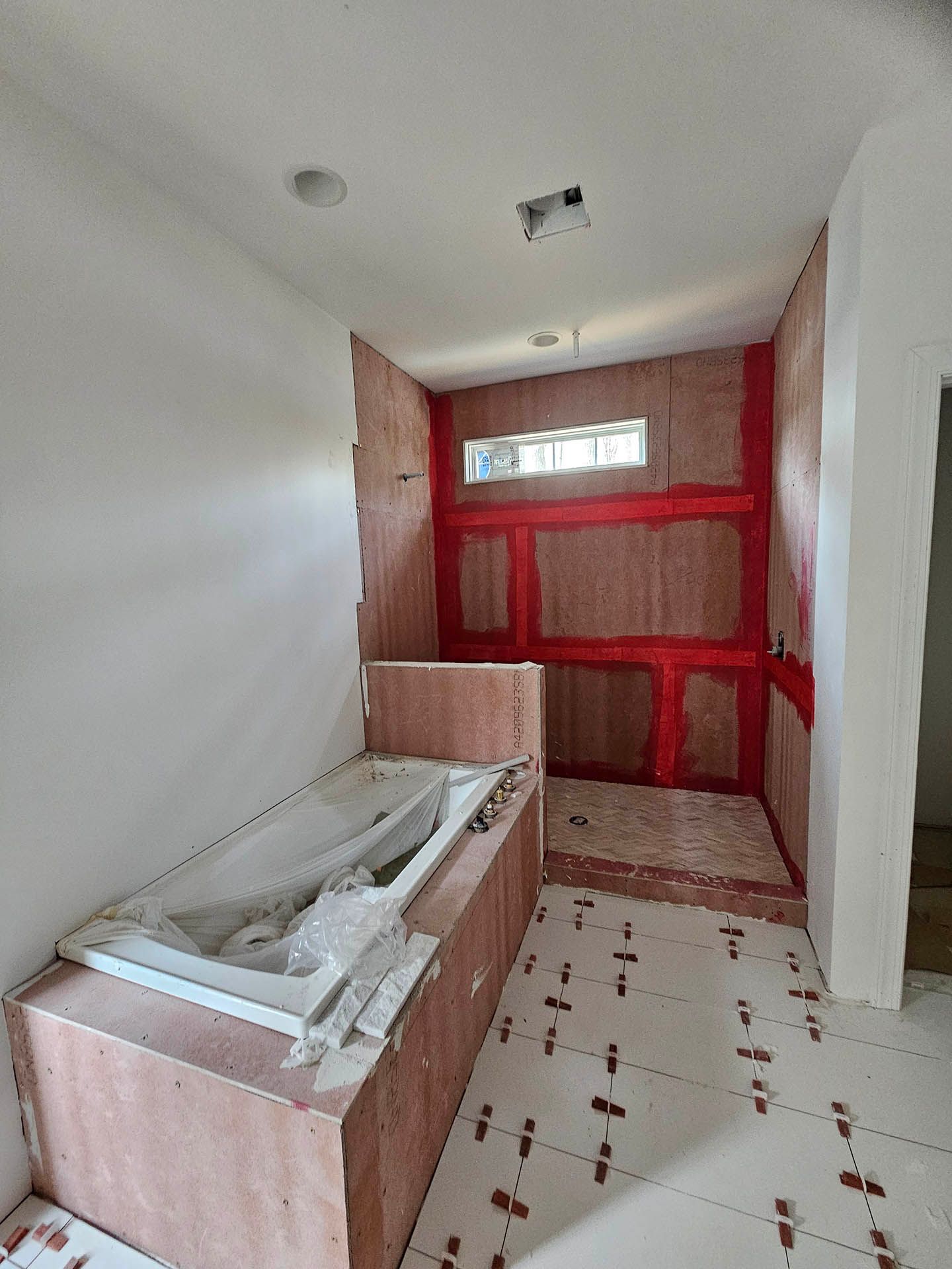 A bathroom under construction with a jacuzzi tub.