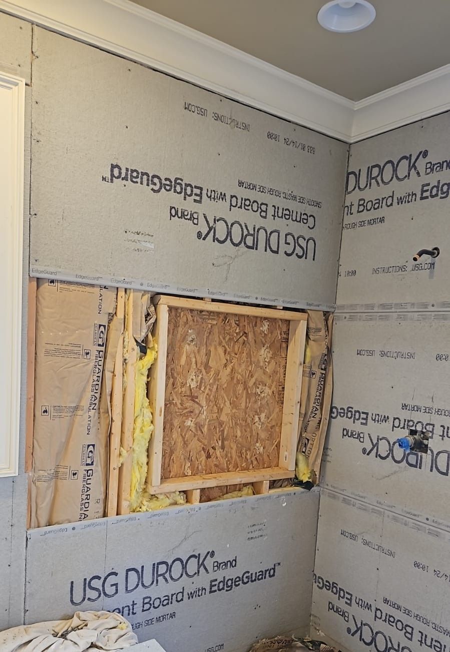 A wall with a hole in it and usg durock on it