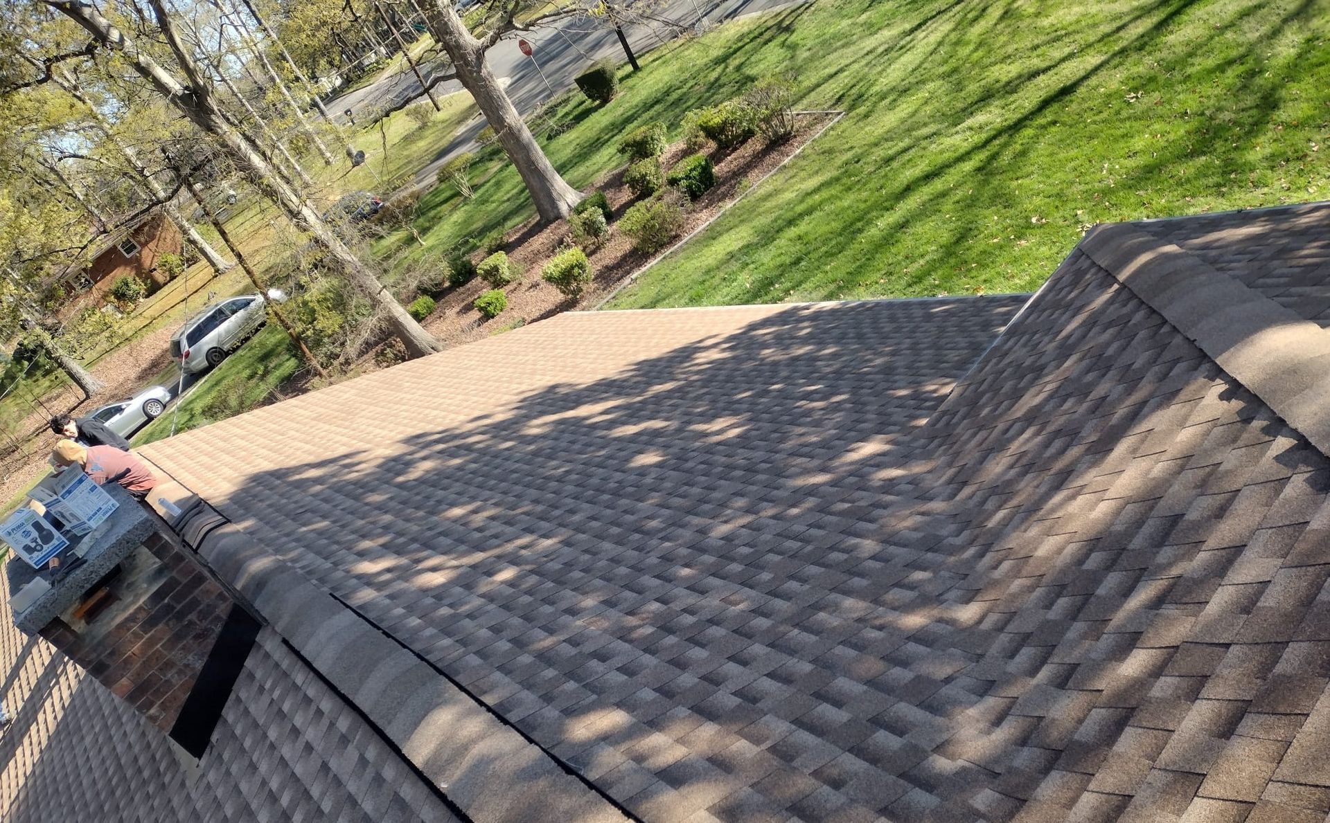A roof with a lot of steps leading up to it and trees in the background.